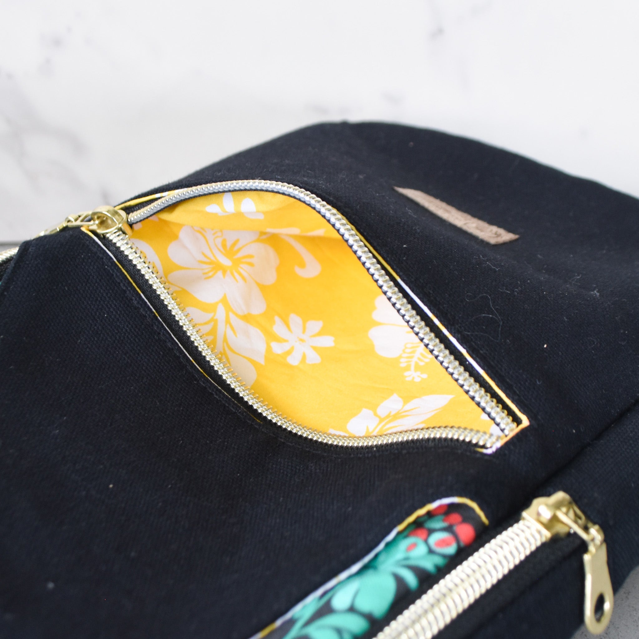 Lehua After Dark Sling Backpack